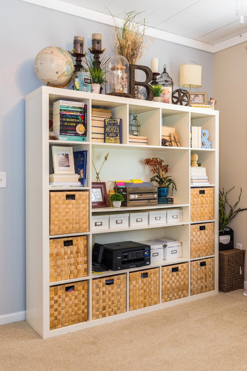 large bookshelf with wicker baskets in las palmas condo st augustine