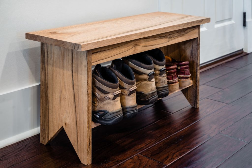 small bench with boots in longleaf house in st johns county Florida