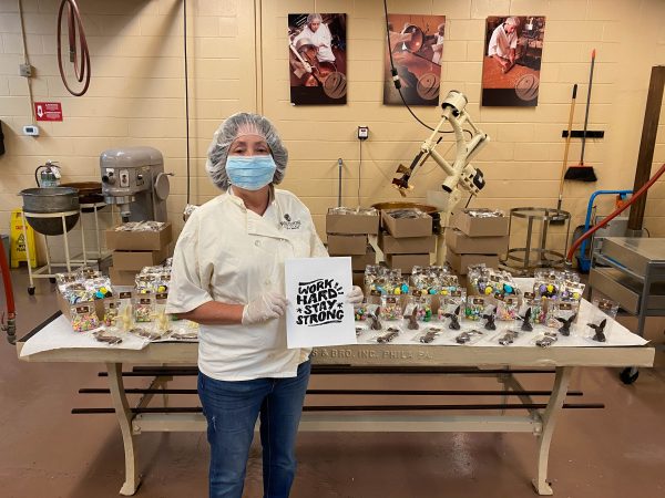 a worker at whetstone chocolates makes goodies for local hospital workers